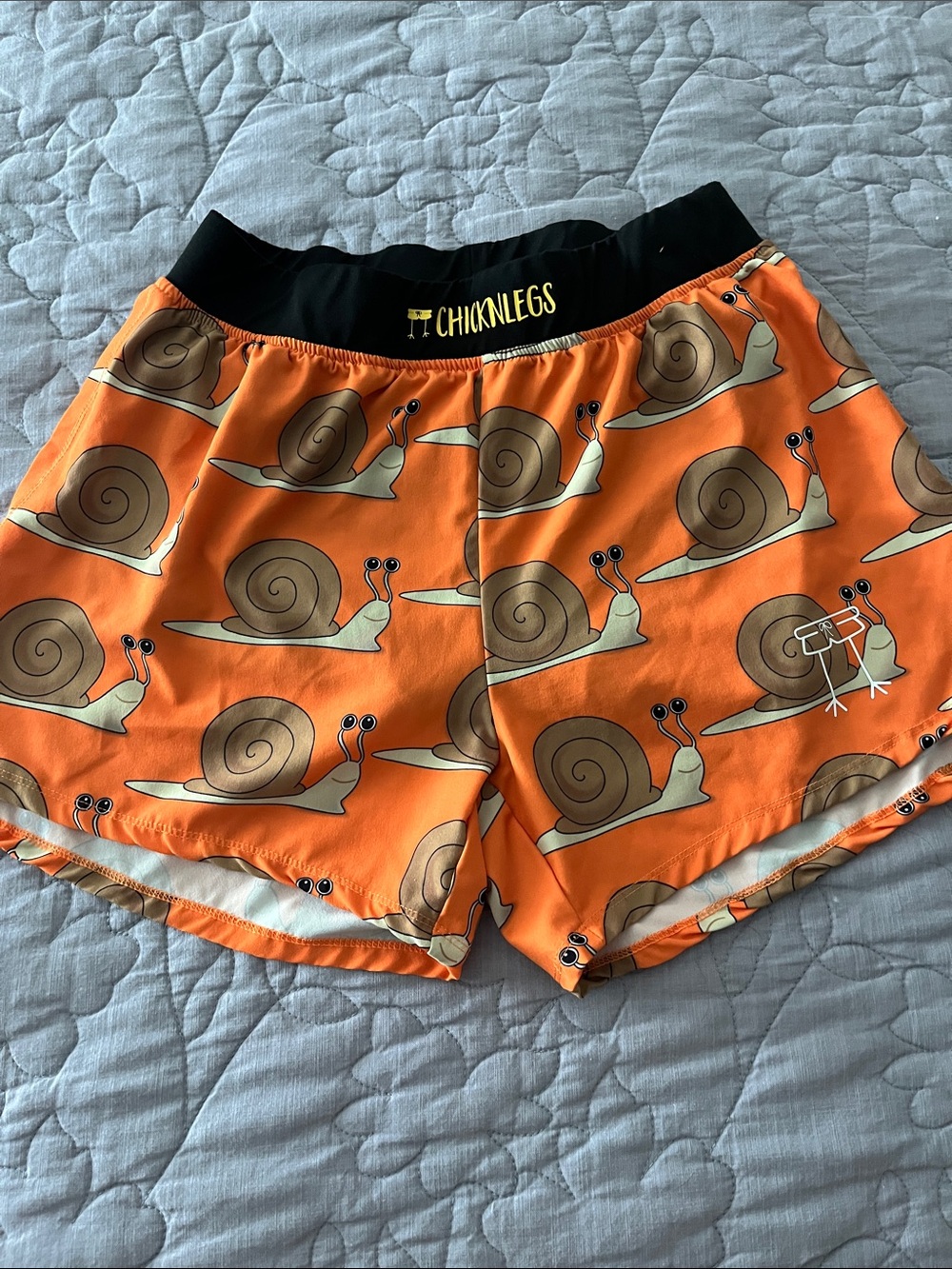 Chicknlegs Orange Snail-Print men’s running Shorts